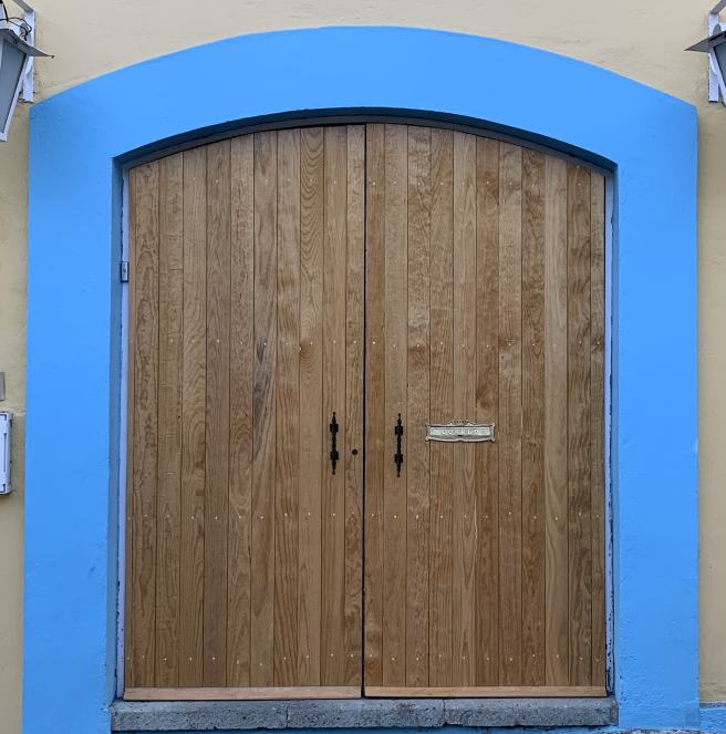 Wooden doorway with blue trim