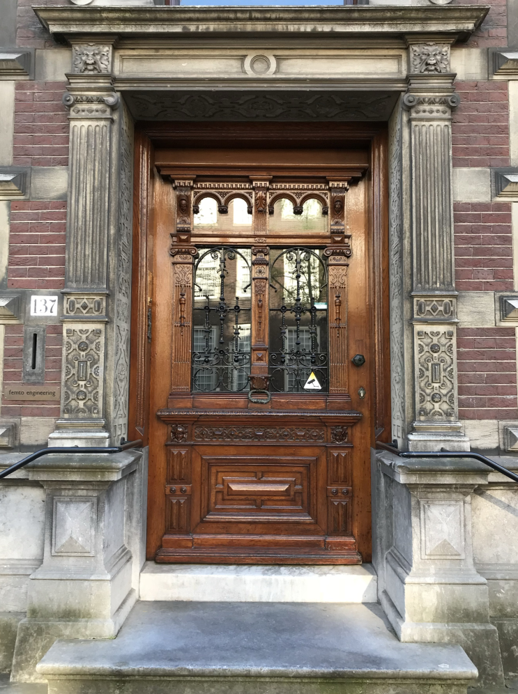 Wooden doorway with metal insets