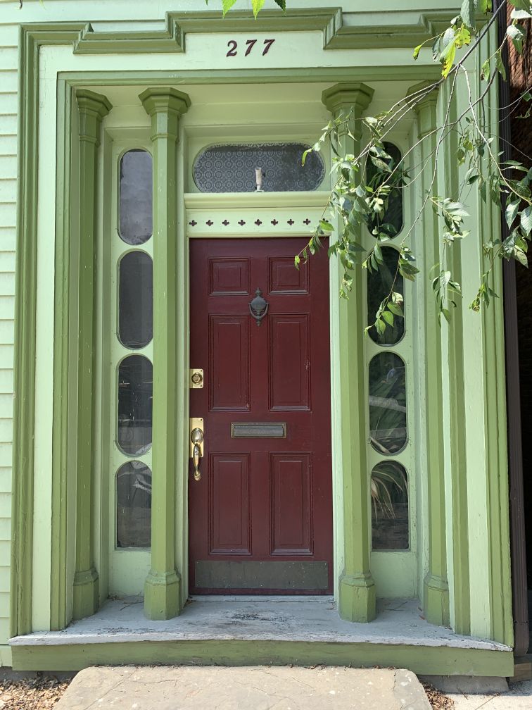 Door with elaborate green surround