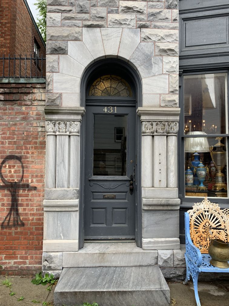Door with tall arched stone surround